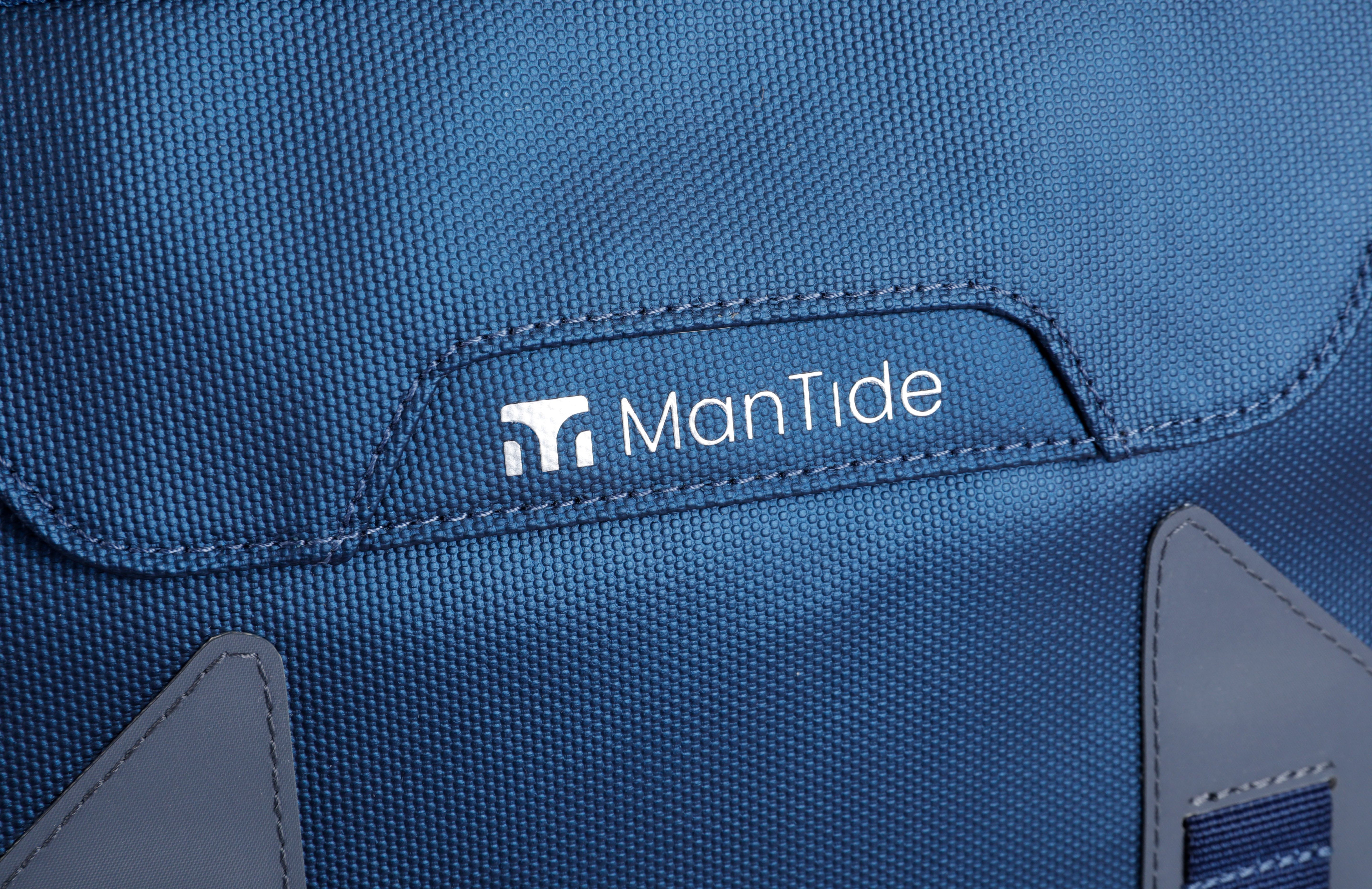 Deepsea Blue TideTrail backpack stylish ManTide logo on large front pocket