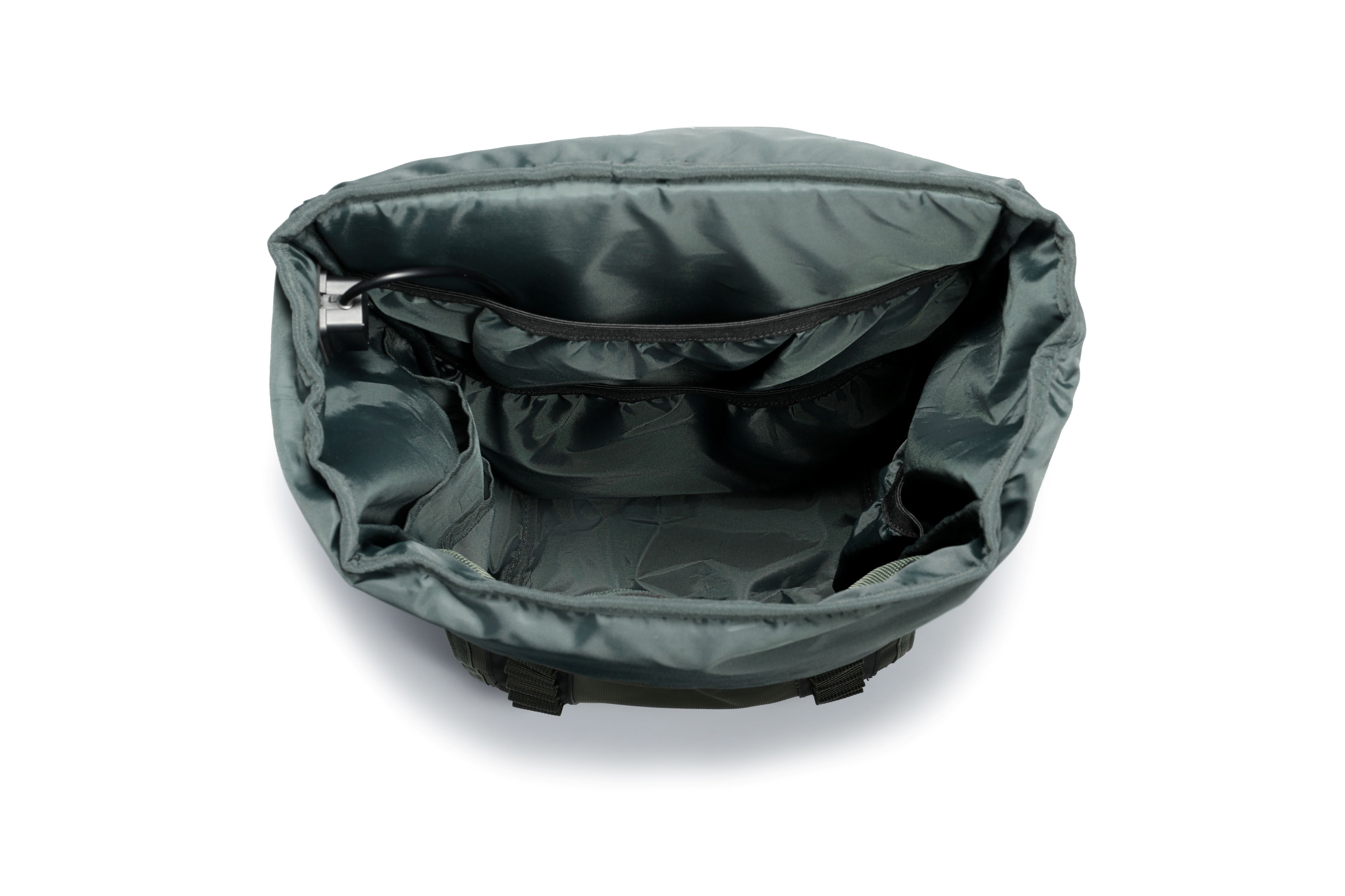 Khaki Green TideTrail internal compartments including side pockets, secured zipper mesh pocket. Also shown is the USB cable for power bank connectivity