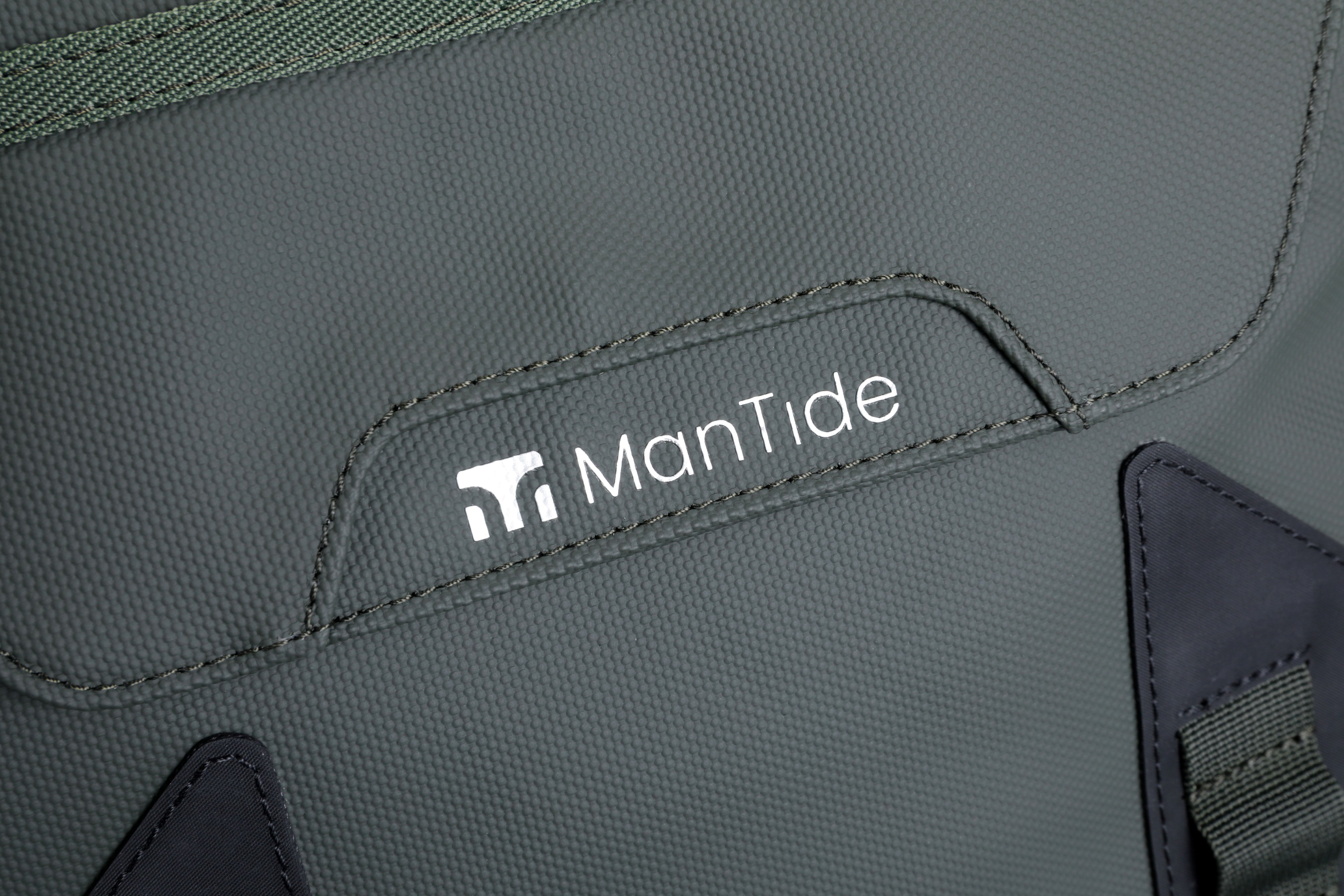 Khaki Green TideTrail backpack stylish ManTide logo on large front pocket